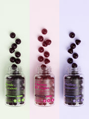 Pots de gummies Brûle-Graisse, Cheveux et Ongles et Meilleur Sommeil ouverts sur des bandes de couleur